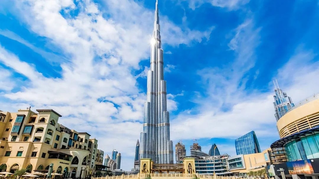 Burj Khalifa towering over Dubai skyline on a clear day.