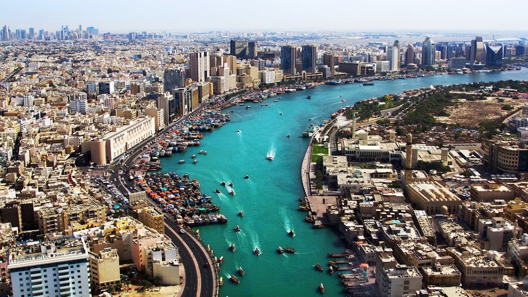 Dubai Creek with boats and city skyline, part of Snapshot Tour of Dubai.