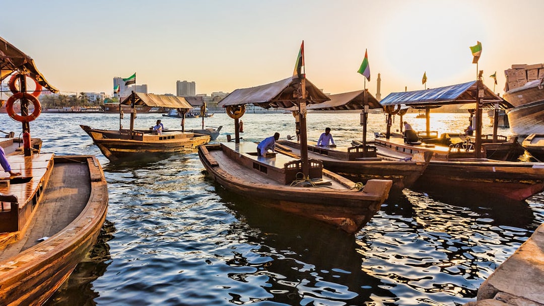 Abra boats on Dubai Creek at sunset during Snapshot Tour of Dubai.