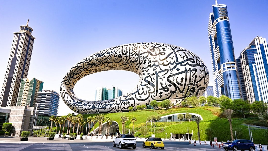 Museum of the Future in Dubai with surrounding skyscrapers, part of Big Bus tour.