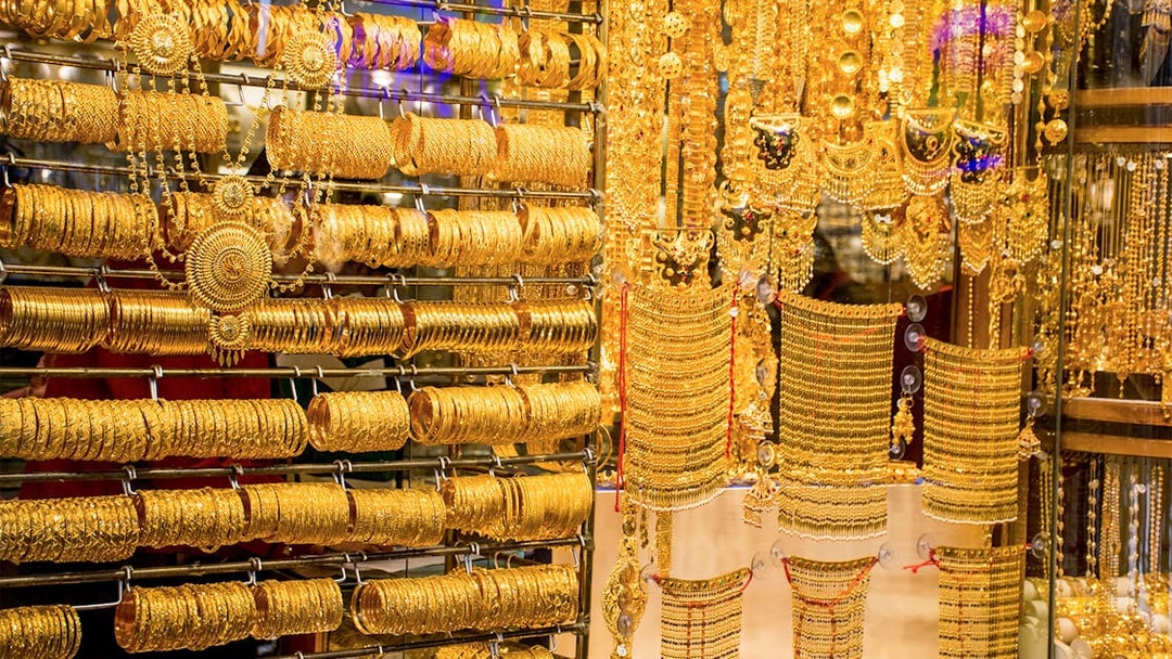 Gold jewelry display at Dubai Gold Souk during half-day sightseeing tour.