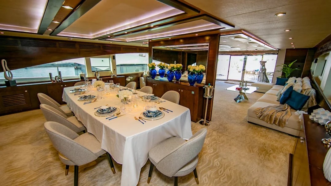 Superyacht TriDeck dining area with elegant table setting and ocean view.