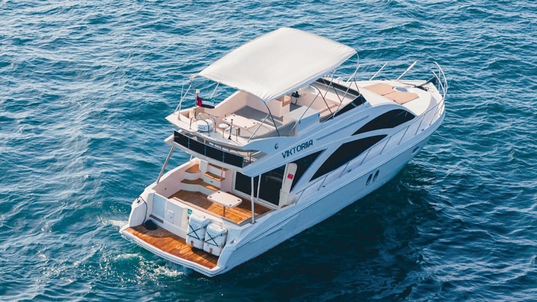 Private luxury yacht sailing in Dubai waters, 46 ft vessel.