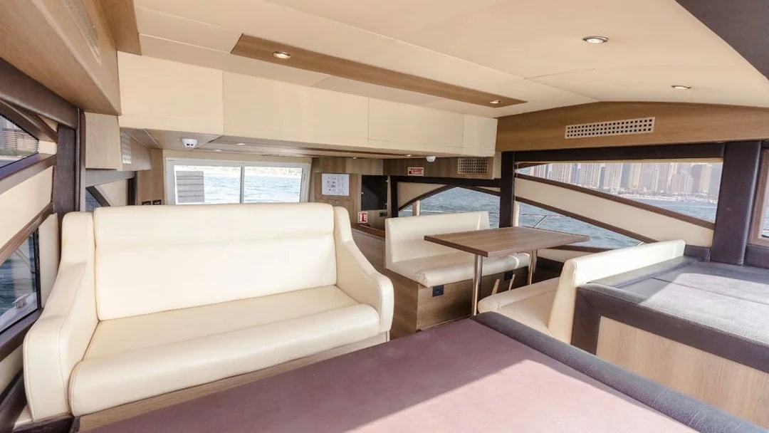 Interior seating area of Viktoriia Luxury Yacht with ocean view.