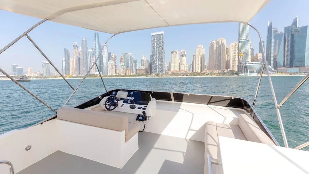 Viktoriia Luxury Yacht deck with Dubai Marina skyline in the background.