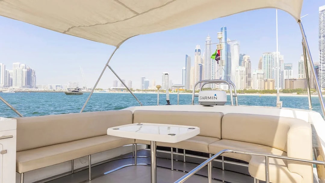 Private yacht deck with Dubai skyline in the background, 46 ft rental.