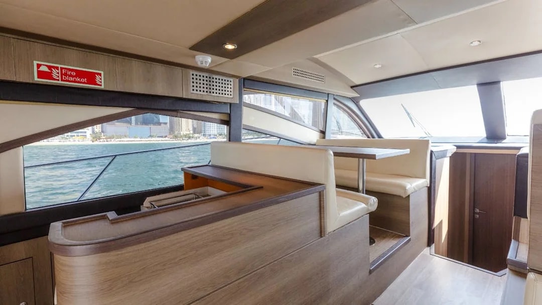 Interior seating area of Viktoriia Luxury Yacht with ocean view.