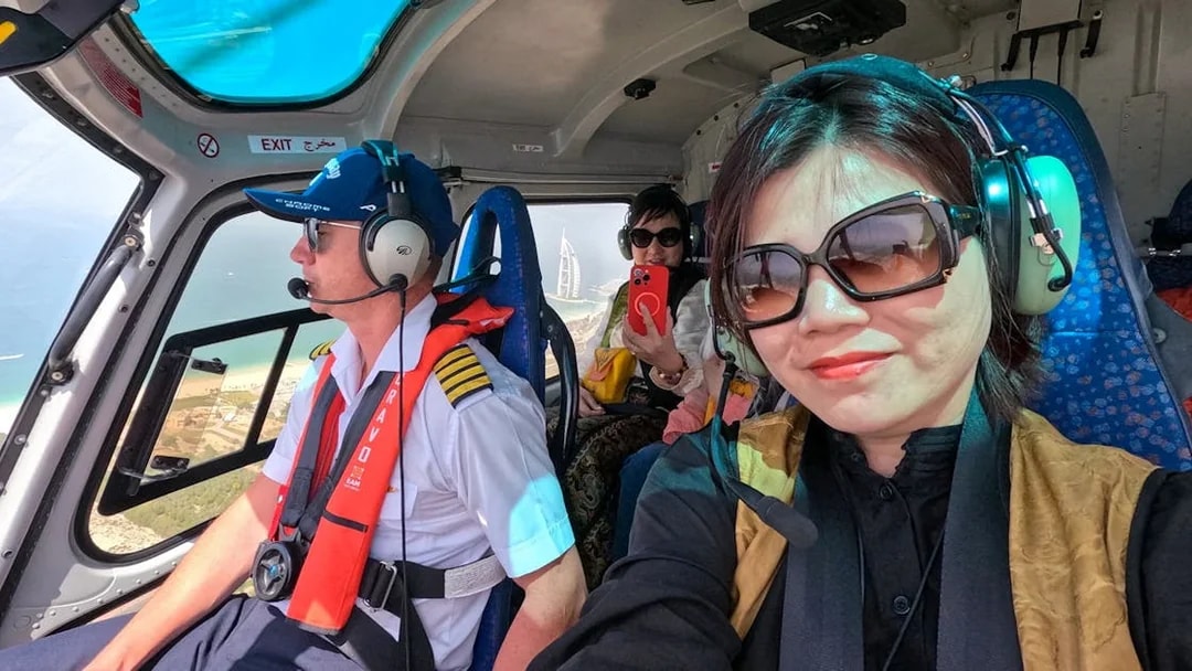 Helicopter passengers view Burj Al Arab during 17 min Dubai tour.