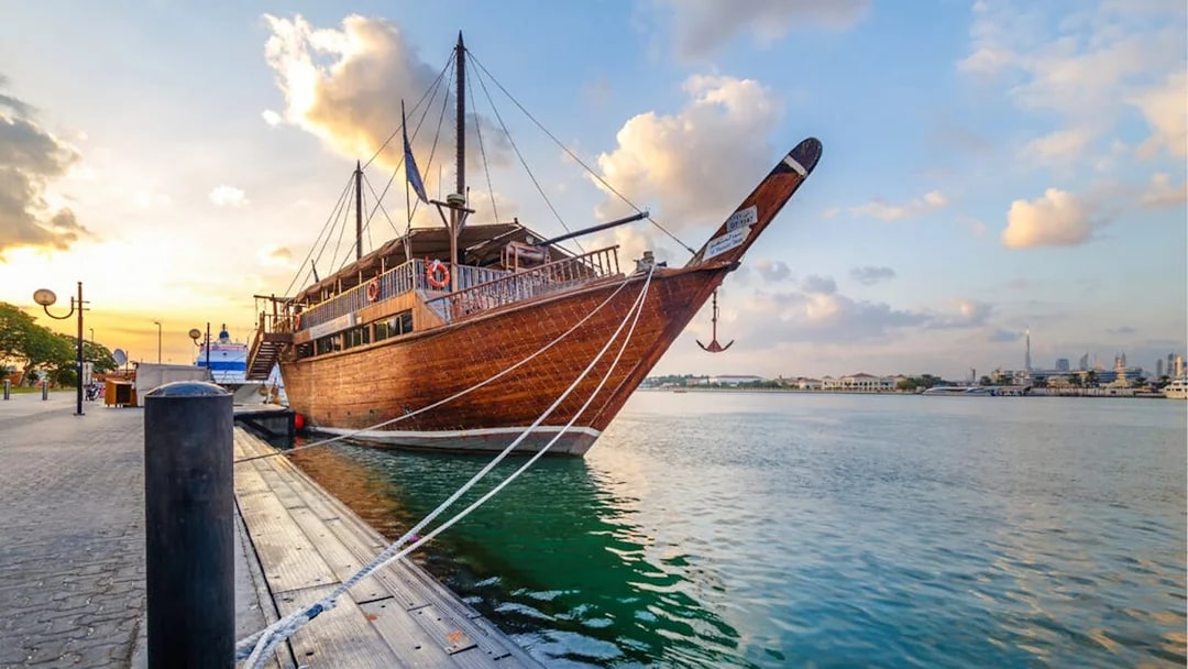 Dhow boat docked at sunset in Dubai Creek, Dubai.