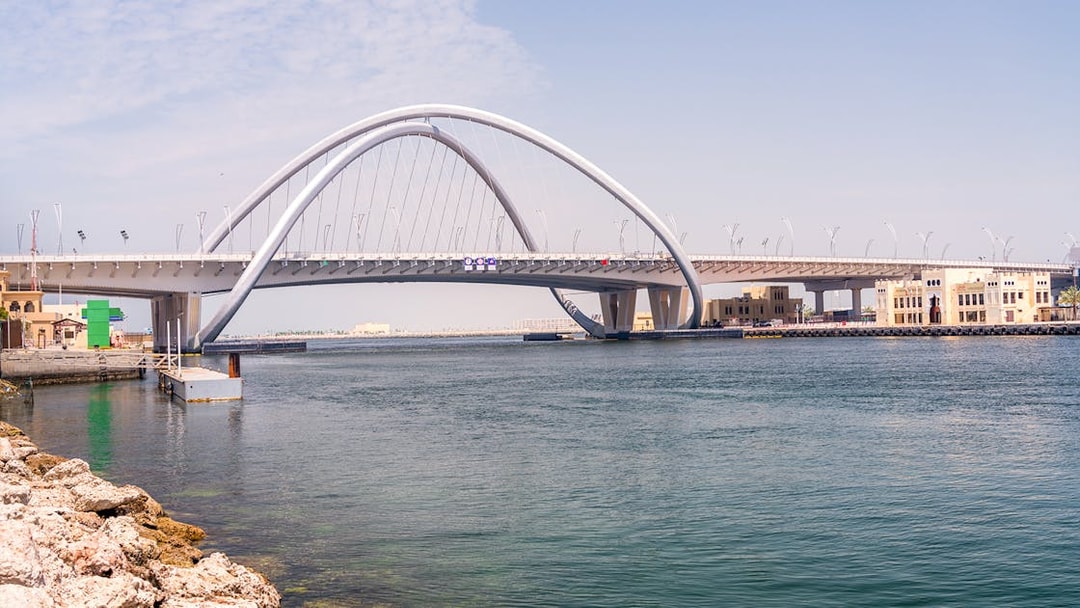 Dubai Creek with Al Garhoud Bridge on a historical tour.