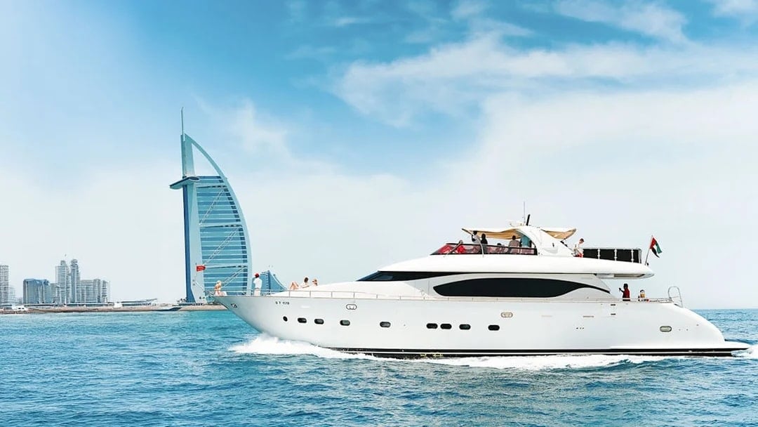 Luxury yacht cruising near Burj Al Arab, Dubai.