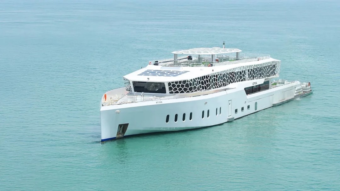 Lotus Mega Yacht cruising in Dubai Marina waters.
