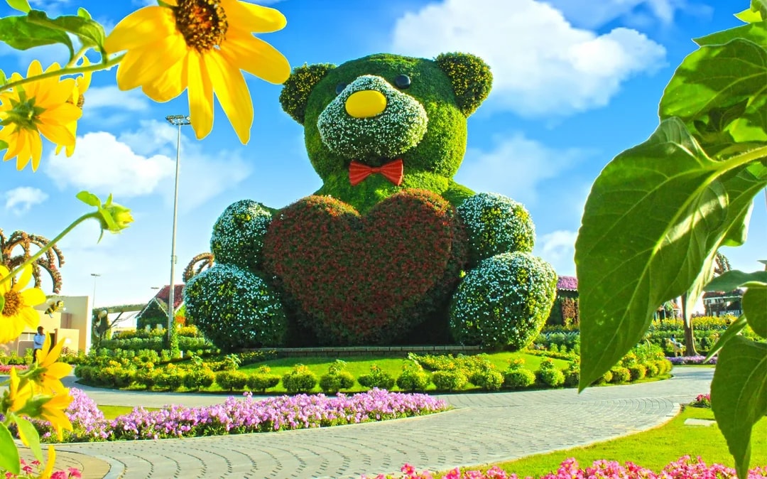 Giant floral teddy bear sculpture at Dubai Miracle Garden.