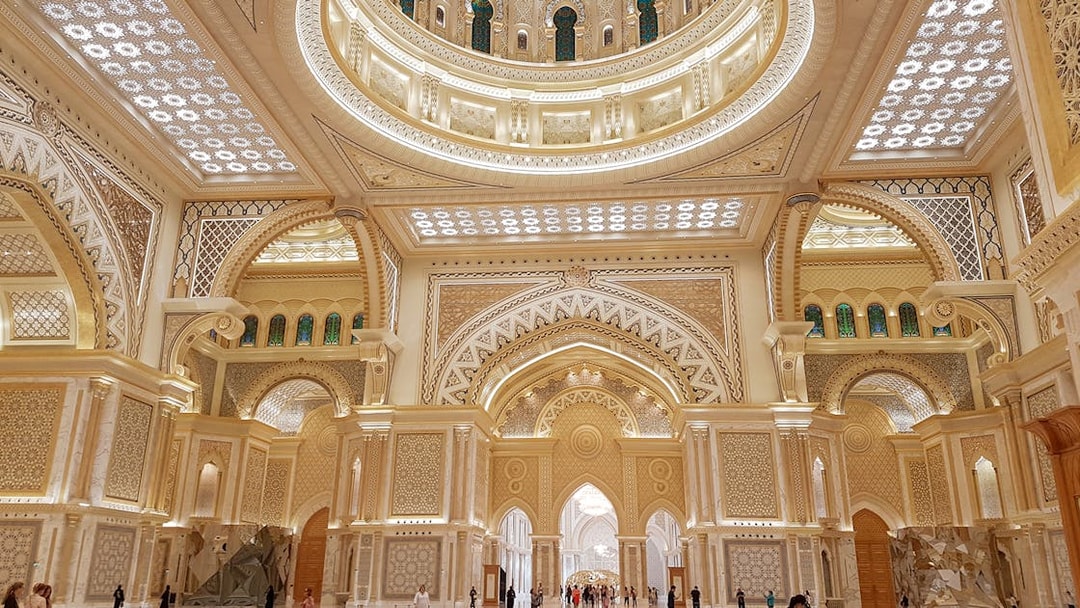 Interior of Qasr Al Watan in Abu Dhabi, showcasing intricate architecture and ornate ceilings.
