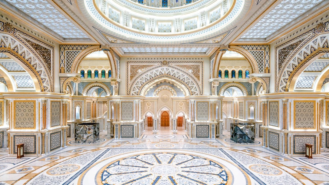 Ornate interior of Qasr al Watan in Abu Dhabi with intricate patterns and grand arches.