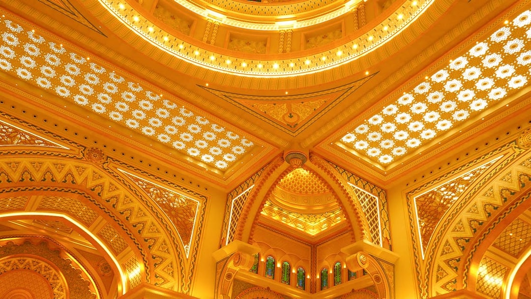 Ornate ceiling details of Qasr Al Watan in Abu Dhabi, showcasing intricate patterns and arches.