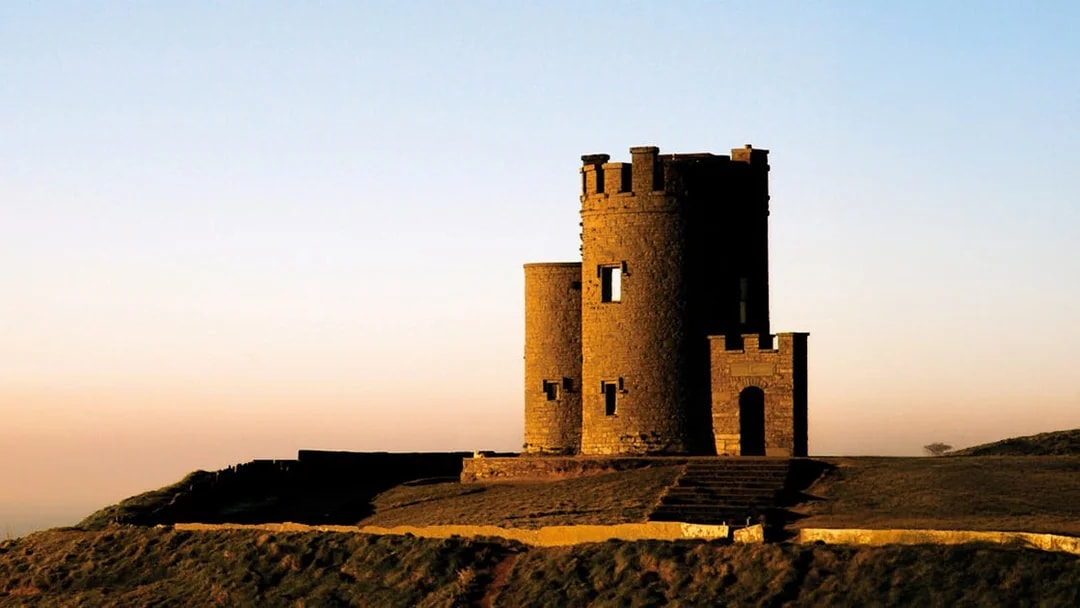 Stone tower at sunset on the Cliffs of Moher, Burren, Ireland.