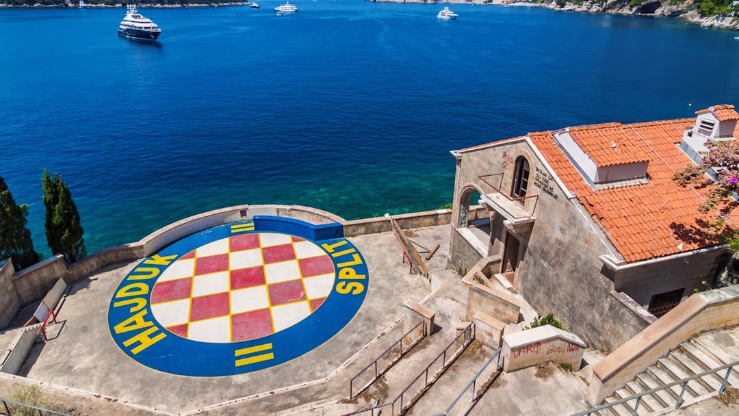 Dubrovnik coastline with Hajduk Split logo, part of Game of Thrones driving tour.