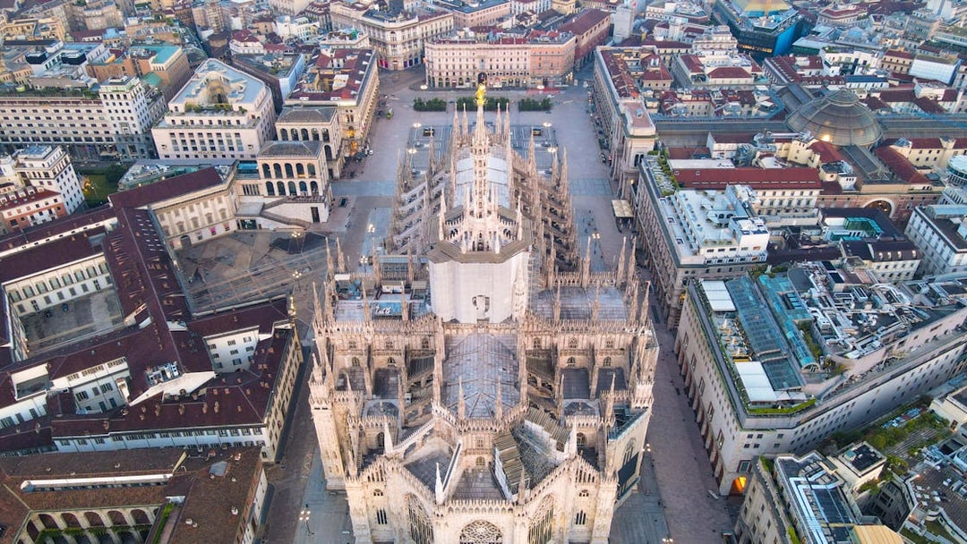 Aerial view of Duomo di Milano surrounded by cityscape.