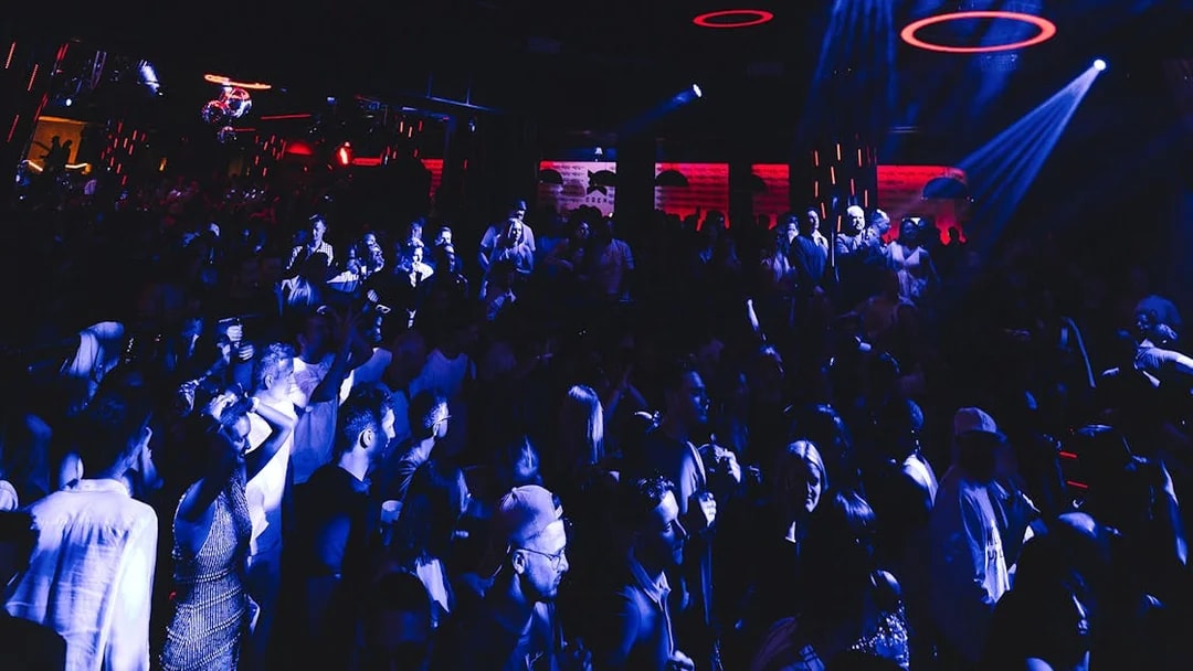 Crowd enjoying a vibrant night at Eden on Sundays event with dynamic lighting.