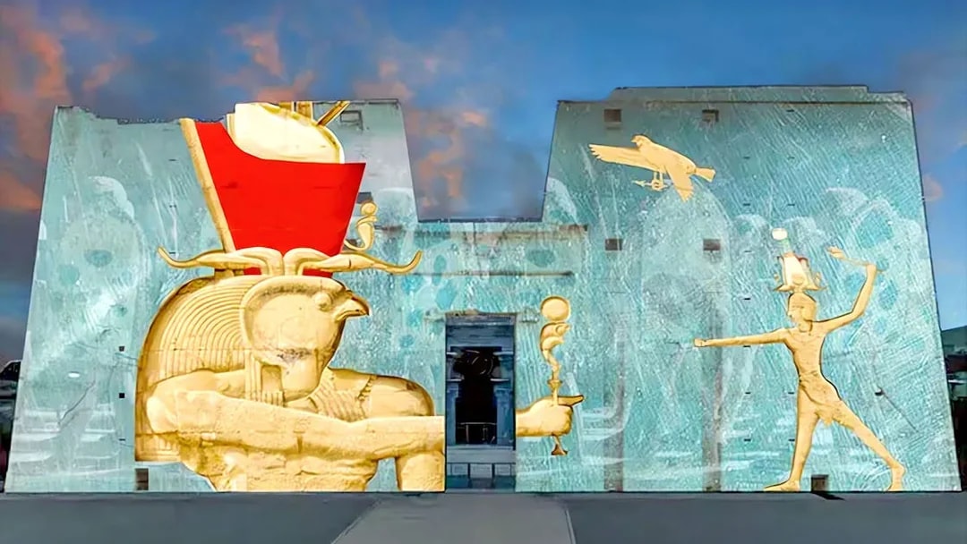 Sound and Light Show projection on Edfu Temple walls, featuring ancient Egyptian deities.
