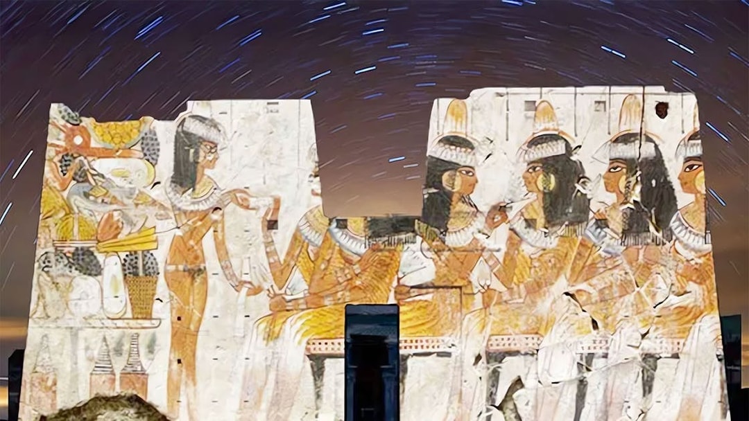 Edfu Temple illuminated with ancient Egyptian carvings during Sound and Light Show.