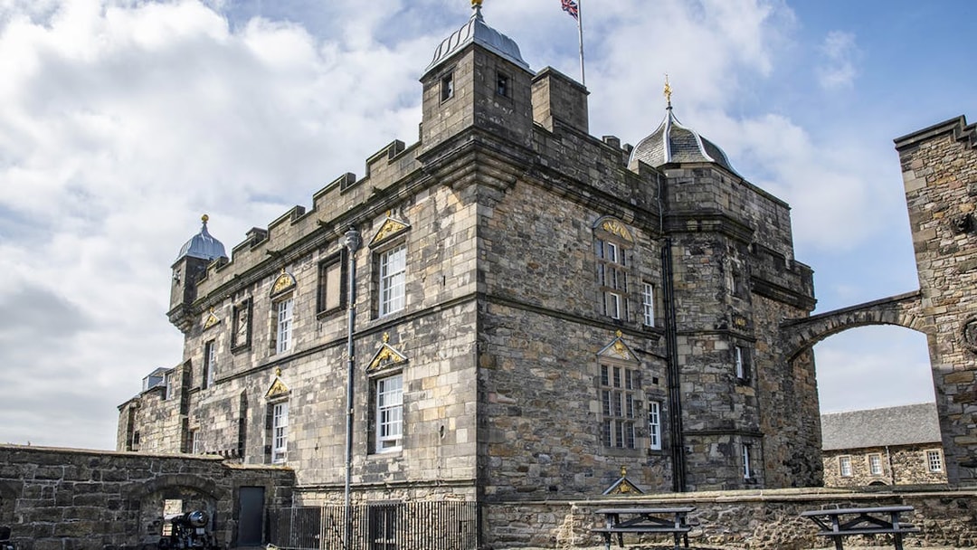 Edinburgh Castle stone facade with archway on guided walking tour.