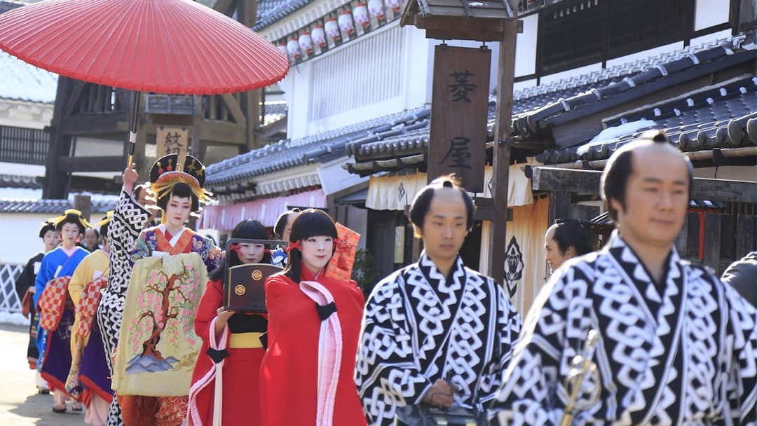 Traditional parade at Edo Wonderland, Japan, featuring participants in historical costumes.