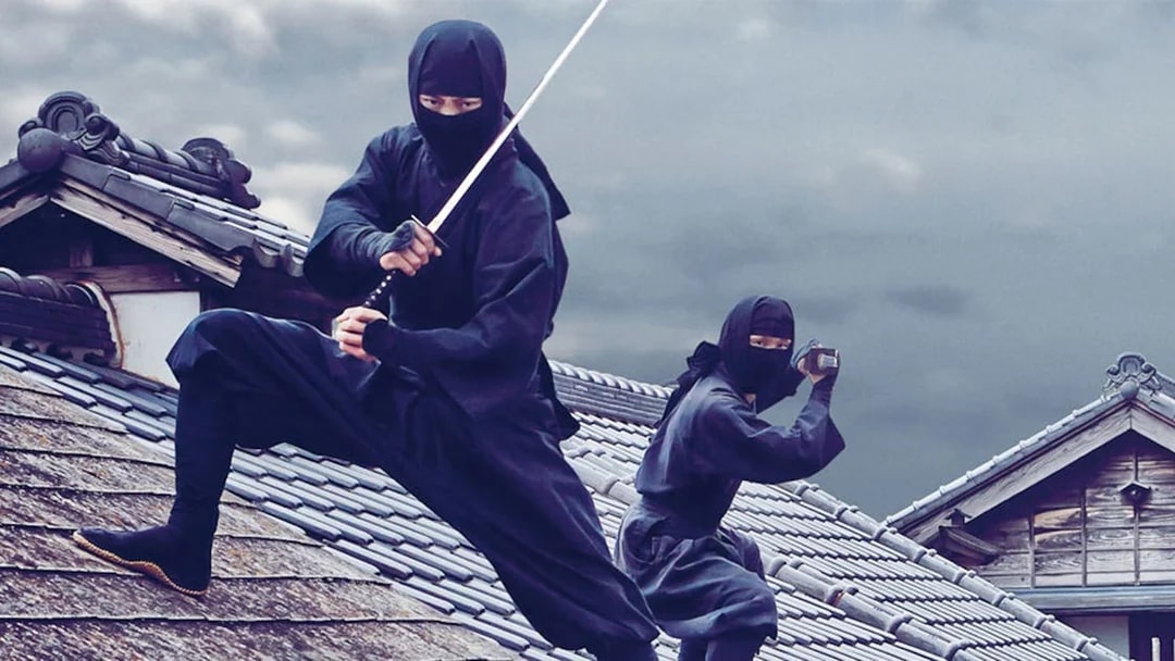 Ninjas on traditional Japanese rooftops at Edo Wonderland.