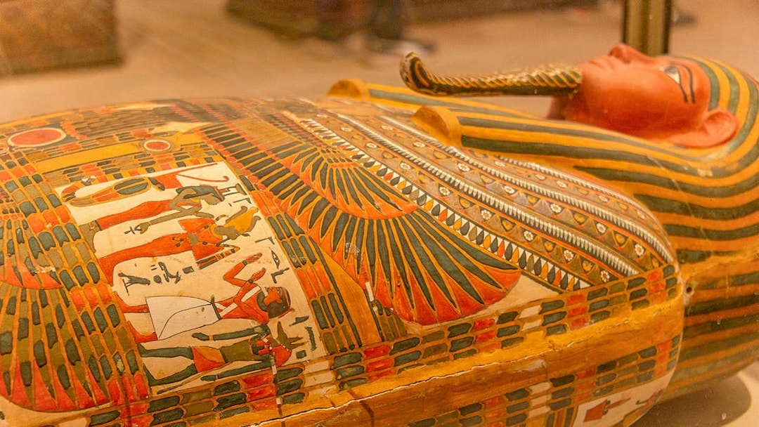 Sarcophagus with colorful hieroglyphics at the Egyptian Museum of Antiquities.