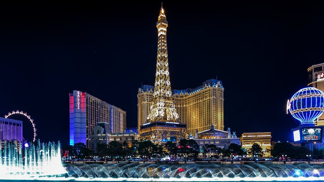 Eiffel Tower replica and fountain show at night, Las Vegas Strip.