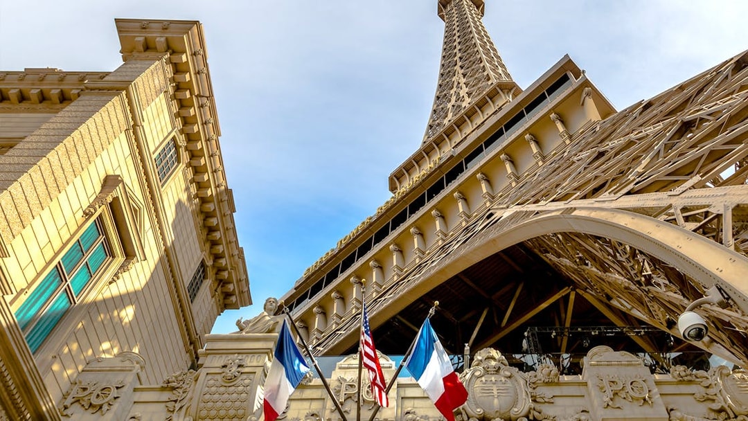 Eiffel Tower replica with French and American flags in Las Vegas.
