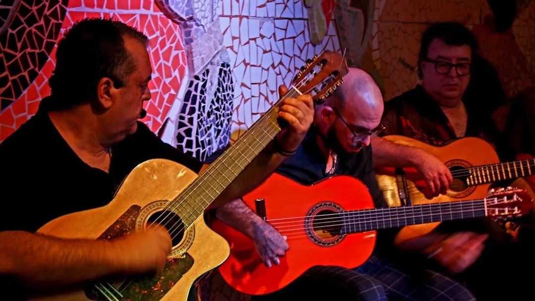 Musicians playing guitars at Flamenco Show, Tablao El Toro y la Luna.