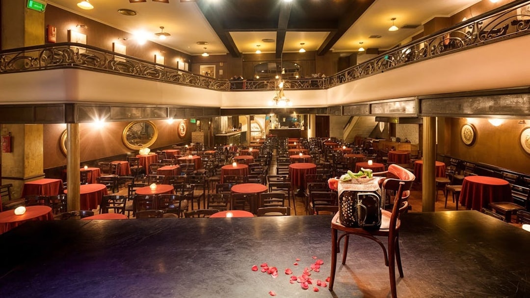 El Viejo Almacén Tango Show venue with stage view and red table settings.