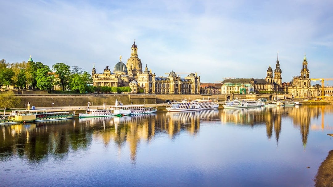 Dresden skyline with historic buildings along the Elbe River during a sightseeing cruise.