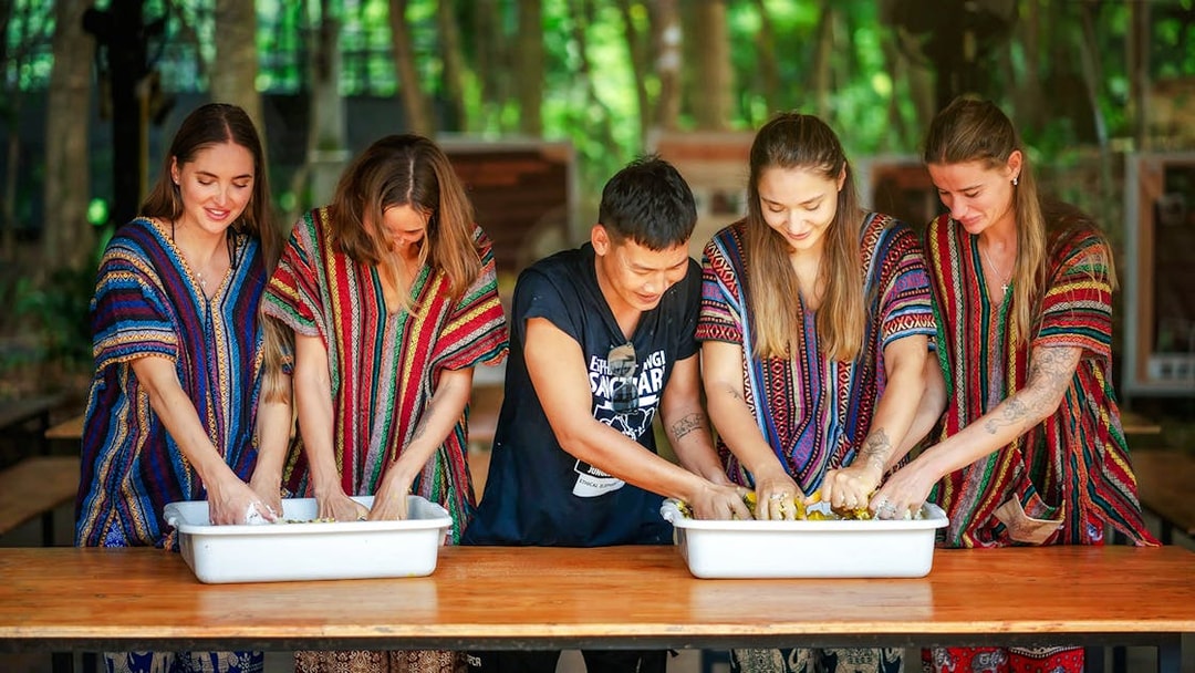 Visitors preparing food for elephants at Elephant Jungle Sanctuary, Phuket.
