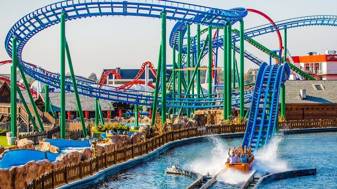 Roller coaster and water ride at Energylandia Amusement Park, Poland.