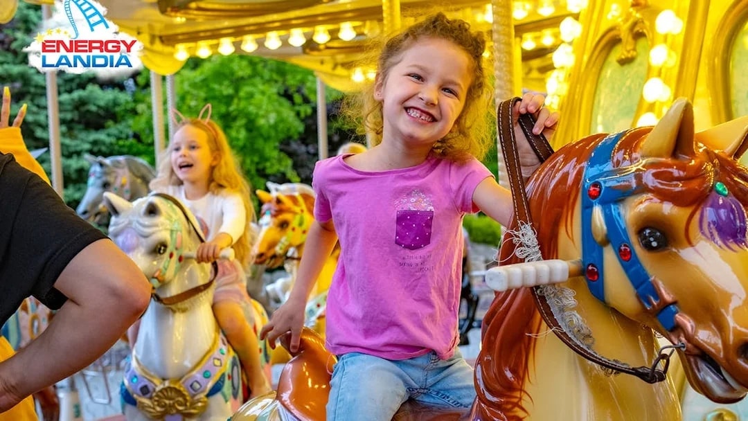 Children enjoying a carousel ride at Energylandia Amusement Park.