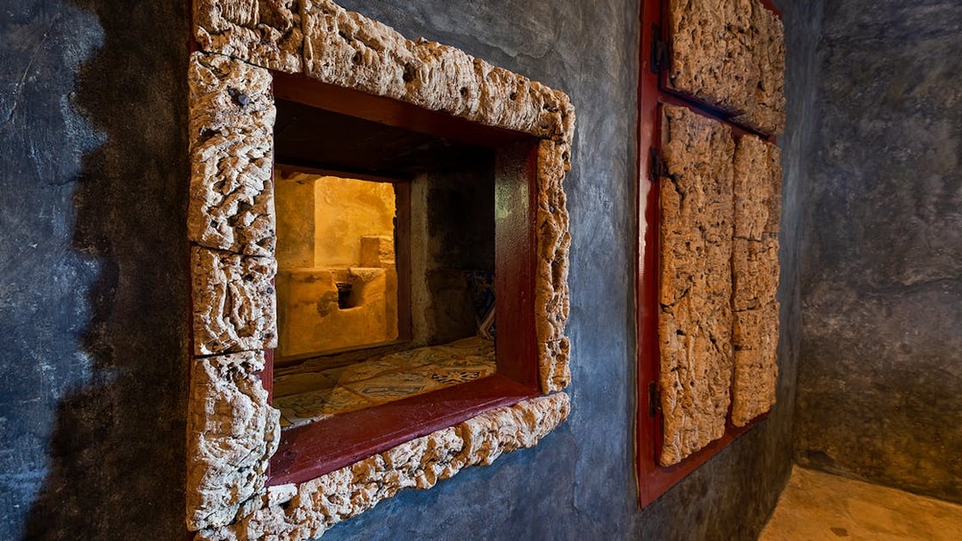 Convento dos Capuchos interior with rustic stone window frame, Sintra, Portugal.