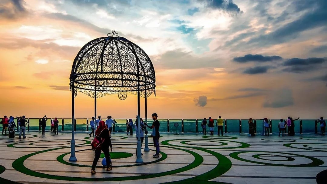 Visitors enjoying sunset views from The Shore Sky Tower observation deck.