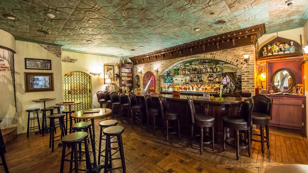 Bar area inside American Prohibition Museum with vintage decor and seating.
