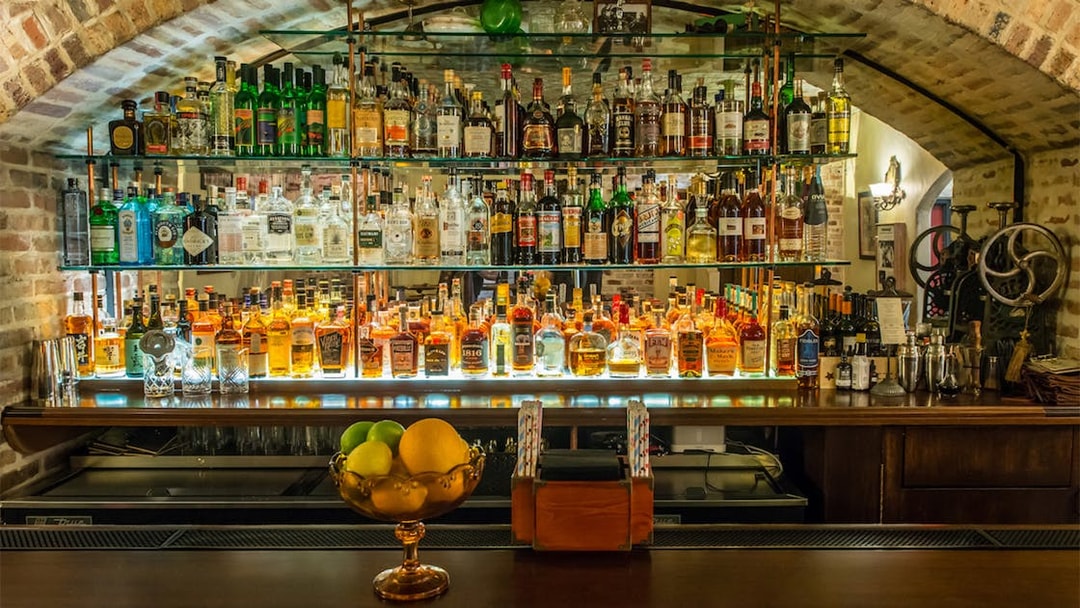 Bar display with vintage liquor bottles at American Prohibition Museum.