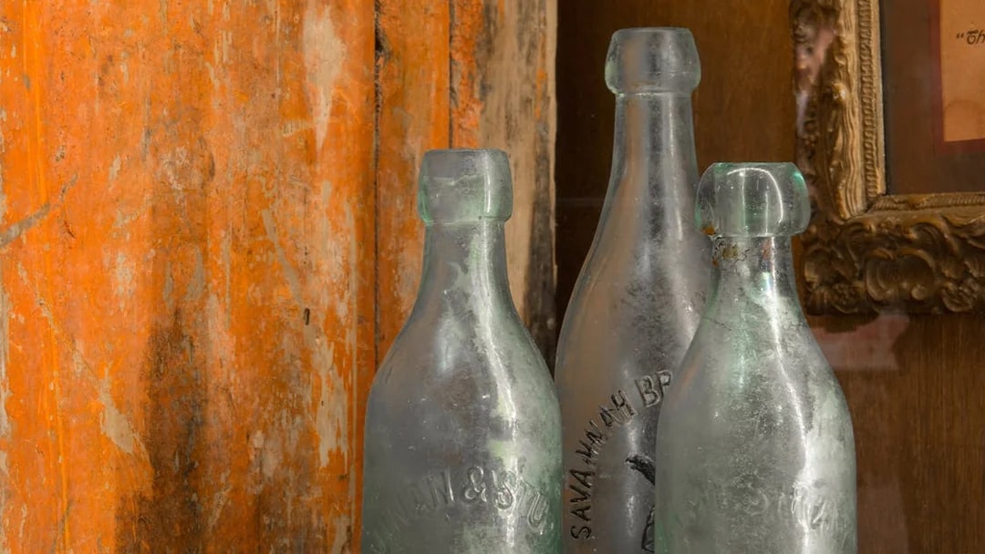 Vintage glass bottles at American Prohibition Museum in Savannah.