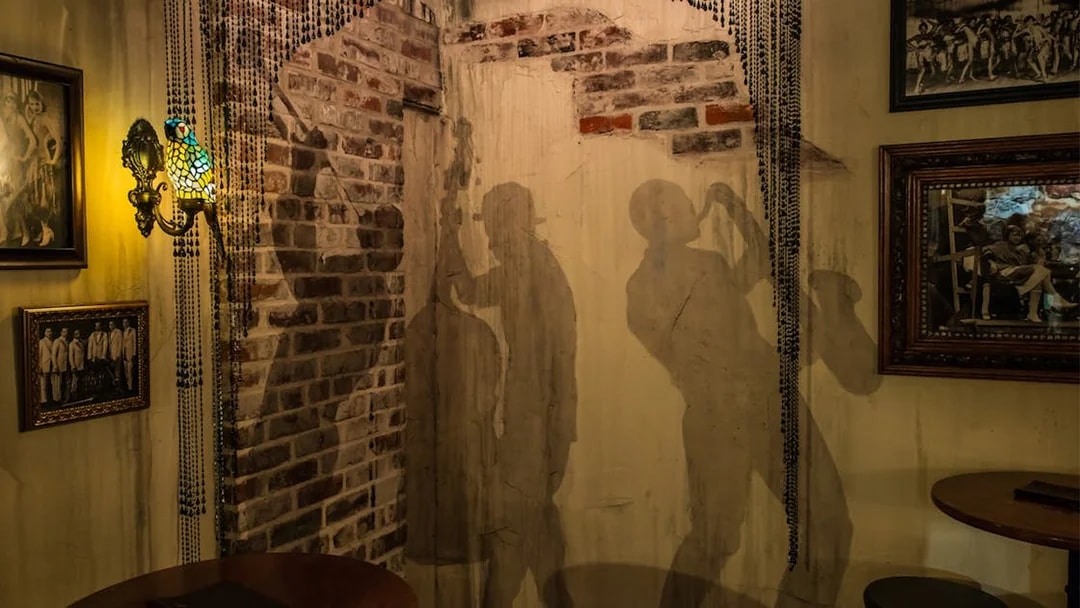 Jazz musician silhouettes on a brick wall at American Prohibition Museum.