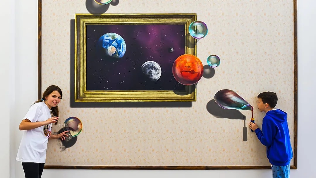 Visitors interacting with a 3D space-themed artwork at Illusion Art Museum Prague.