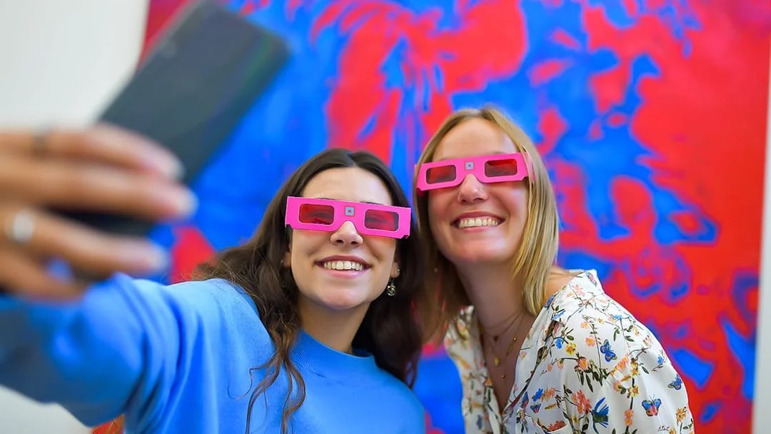 Visitors wearing 3D glasses at Illusion Art Museum Prague.