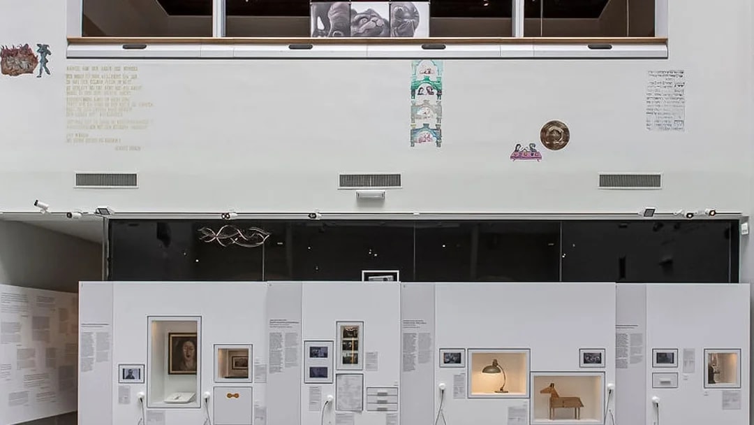 Exhibit display at Jewish Museum Vienna featuring historical artifacts and photographs.