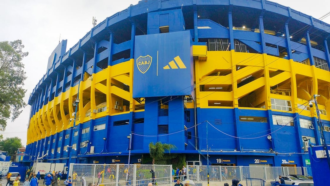 La Bombonera stadium exterior with people walking outside, Buenos Aires, Argentina.