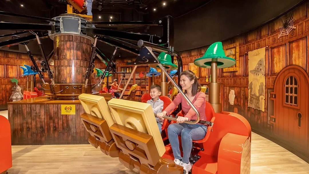 Family enjoying a ride at LEGOLAND® Discovery Centre Hong Kong.