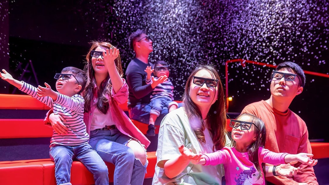 Families enjoying a 4D cinema experience at LEGOLAND® Discovery Centre Hong Kong.